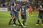 Minnesota United players celebrate during a 1-0 victory over Indy Eleven on Wednesday night in Blaine.