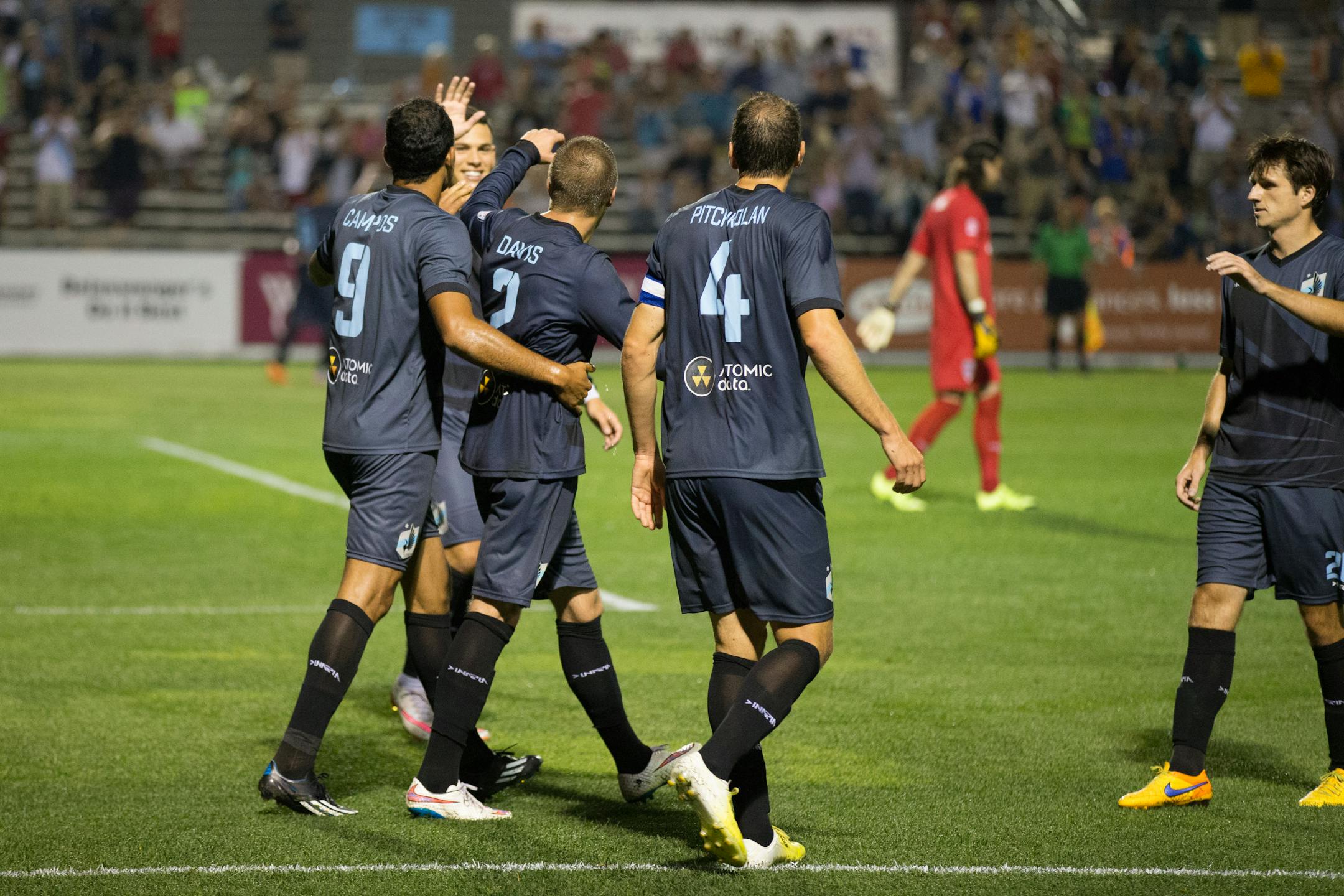 Minnesota United players celebrate during a 1-0 victory over Indy Eleven on Wednesday night in Blaine.