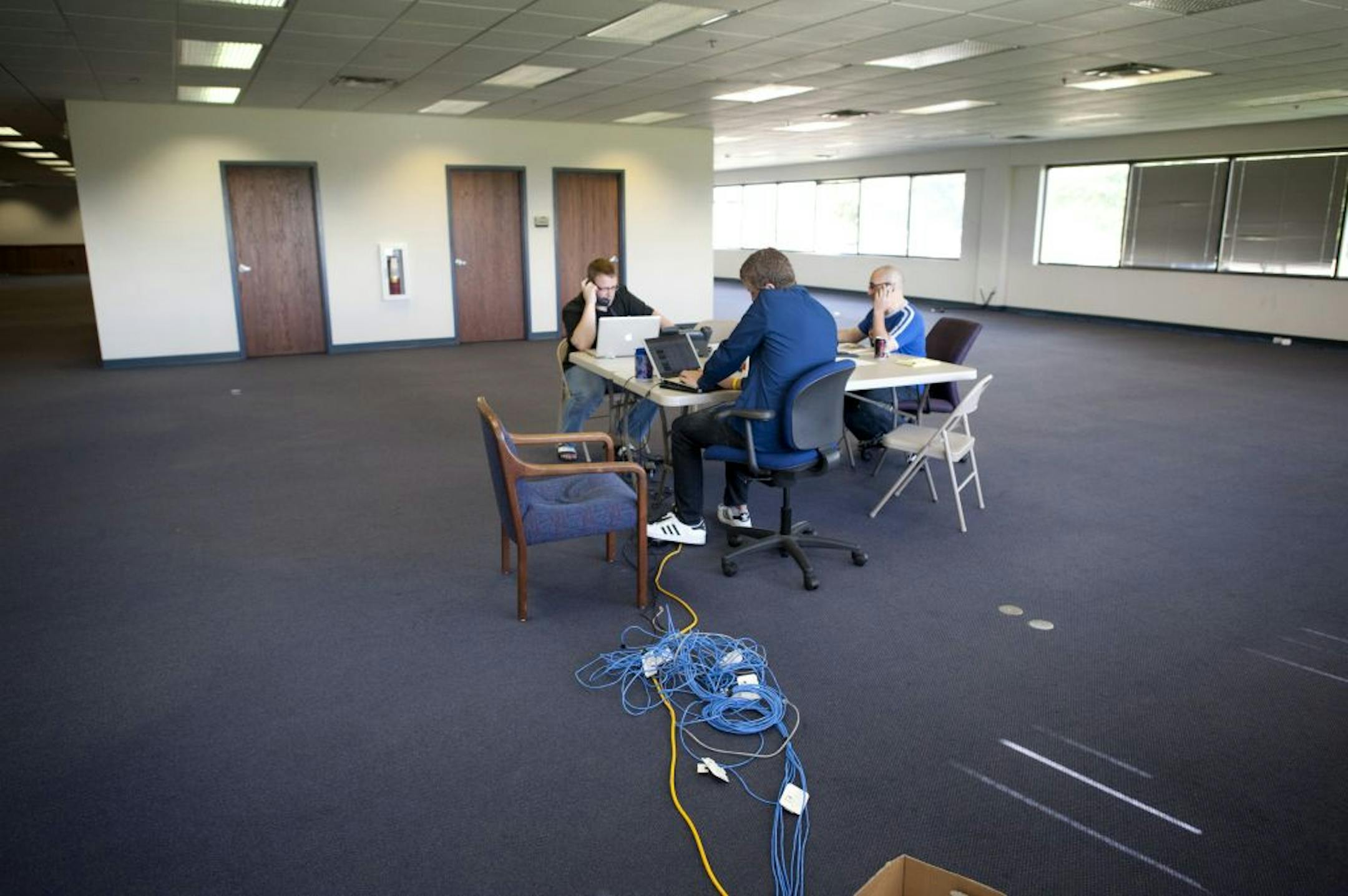 Pawlenty campaign workers tried to drum up support for the candidate's town hall meeting the following day from their Urbandale, Iowa headquarters.