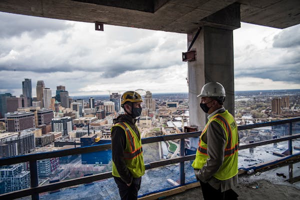 L to R Project manager Mitch Johnson, and Luigi Bernardi, CEO of Arcardia LLC and Kevin Mullen point out the quality construction and views as the rea