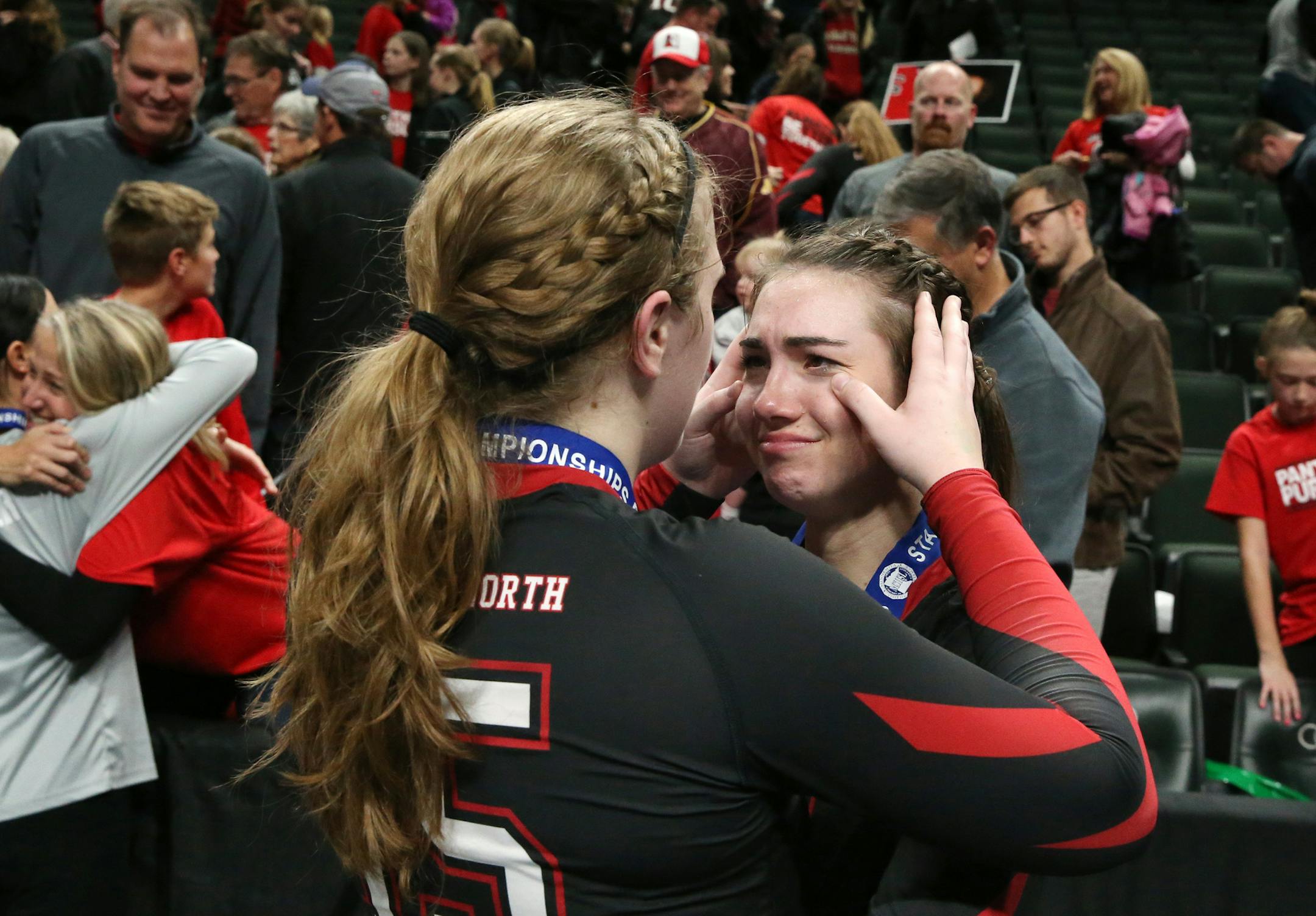 Members of the Lakeville North volleyball team celebrated their Class 3A state title at Xcel Energy Center after they knocked off two-time-defending state champion Eagan.