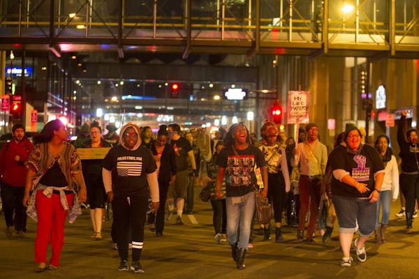 Between 50 and 100 protesters marched Wednesday night in downtown Minneapolis down S. 7th Street.