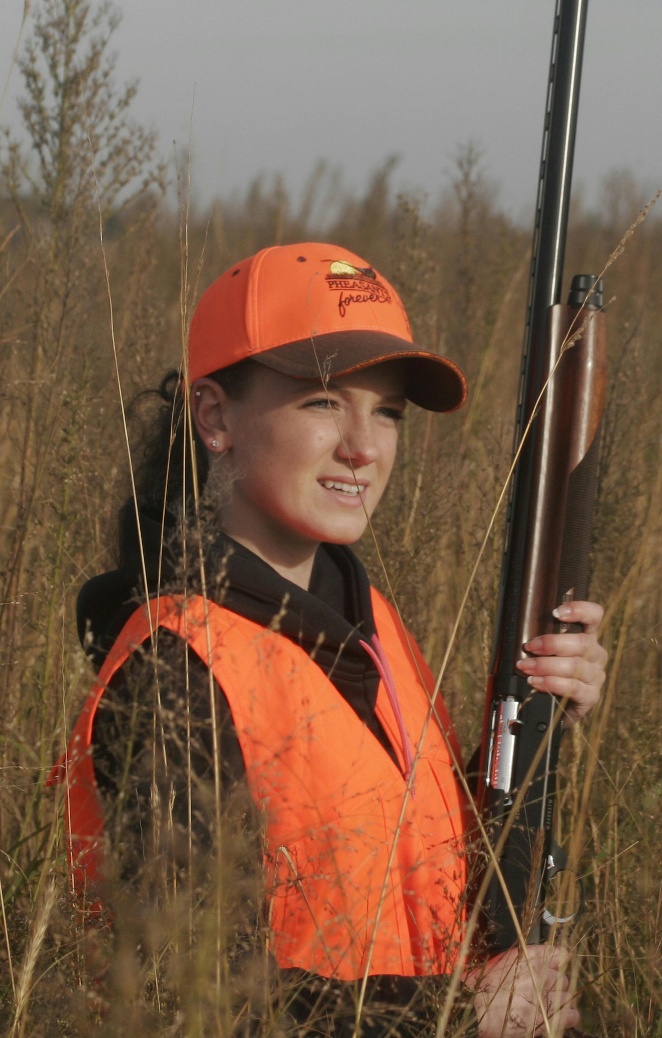 Julia Giefer, 19, of Nicollet, hunted thick cover Saturday on the Governor's Pheasant Opener near Mankato. Giefer's group of five hunters flushed about 20 pheasants Saturday morning, bagging one. Star Tribune Photo by Doug Smith; Oct. 10, 2015.