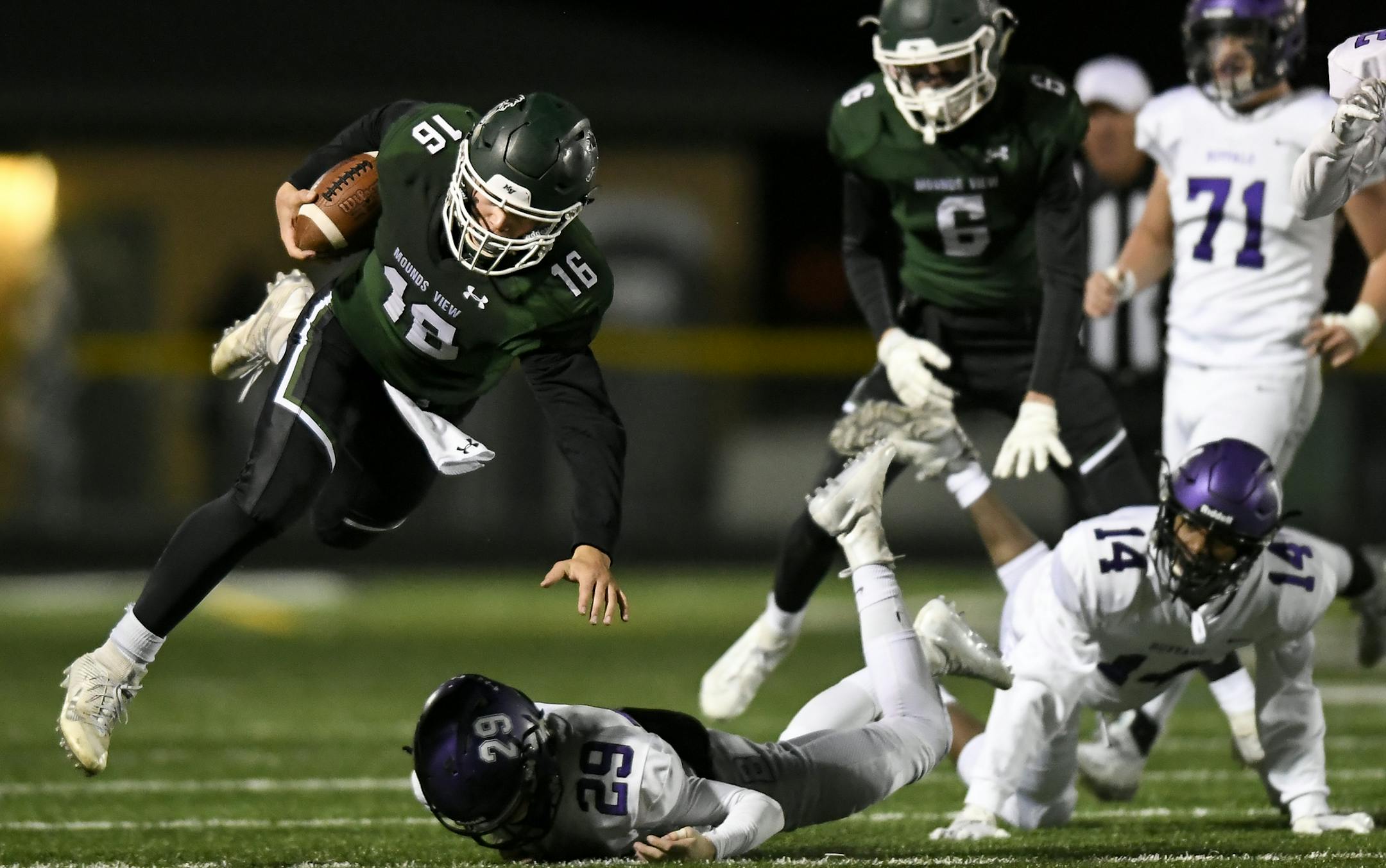 Mounds View quarterback Cole Stenstrom (16) was knocked off his feet but got the first down after being tackled by Buffalo defensive back Brandon Lampi (29) in the third quarter. ] Aaron Lavinsky &#x2022; aaron.lavinsky@startribune.com Buffalo played Mounds View in a high school football game at Mounds View High School on Friday, Nov. 1, 2019 in Arden Hills, Minn.