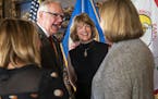 Newly appointed Department of Human Services Commissioner Jodi Harpstead, second from right, laughs with Minnesota Lt. Gov. Peggy Flanagan, from left,