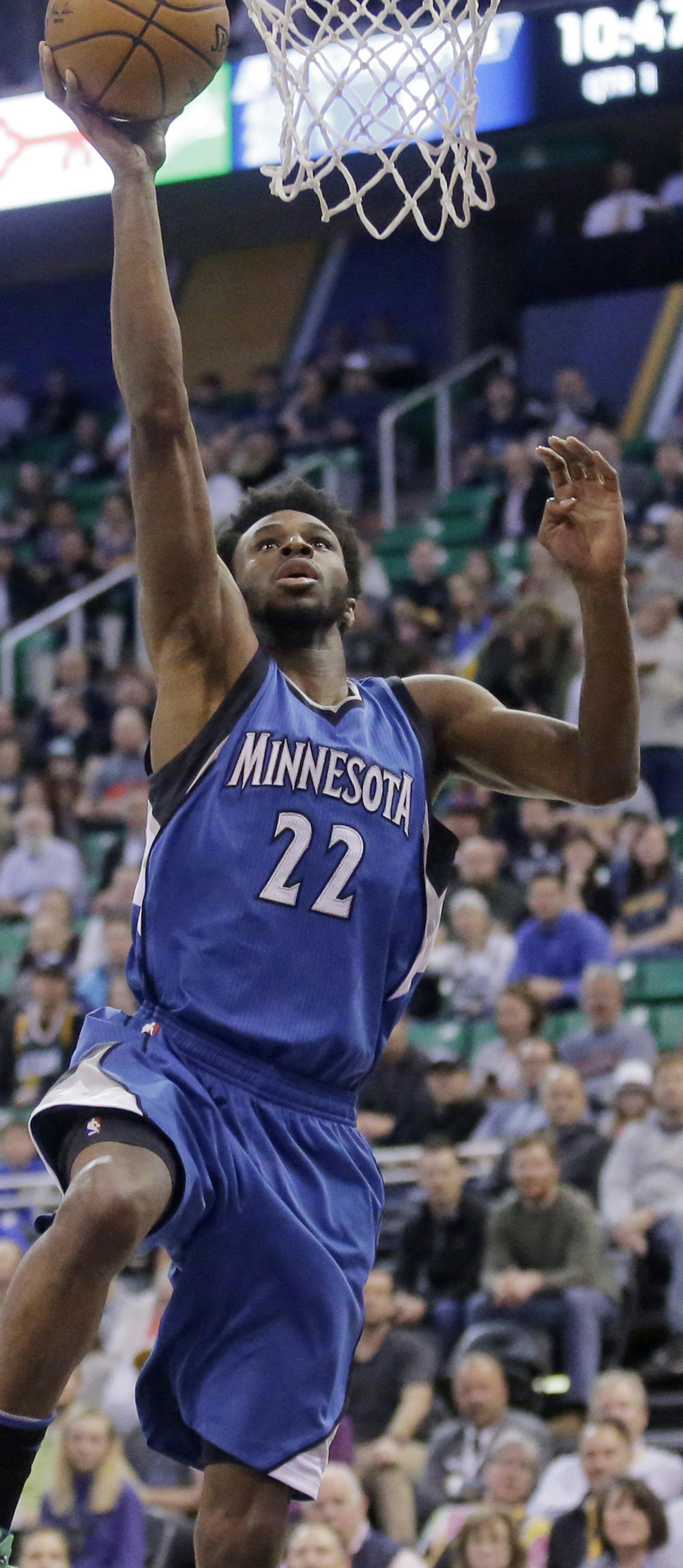 Minnesota Timberwolves forward Andrew Wiggins (22) lays the ball up during the first half in an NBA basketball game against the Utah Jazz Wednesday, March 1, 2017, in Salt Lake City. (AP Photo/Rick Bowmer)