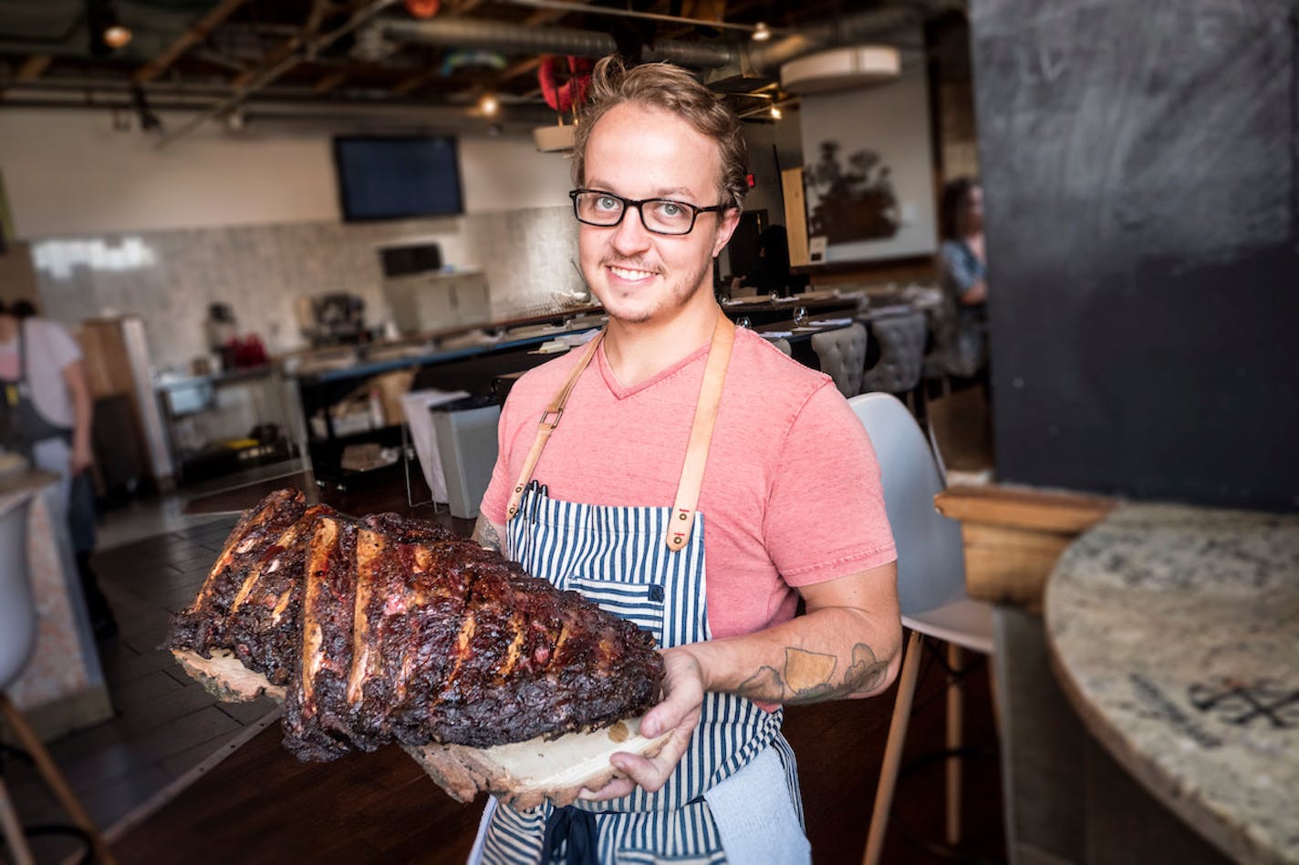 Minnesota Barbecue Company chef Kale Thome with a slab of ribs