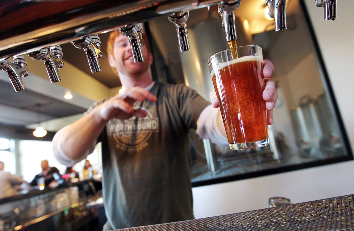 Bryan Campbell, a server at Northbound Smokehouse and Brewpub, said the city should raise the minimum wage to $15 per hour, but keep it at $9.50 per hour for tipped employees. (Courtney Perry/Special to the Star Tribune)