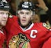Chicago Blackhawks left wing Bryan Bickell (29 second from left) celebrates his power play goal during the second period of their game Sunday at the U