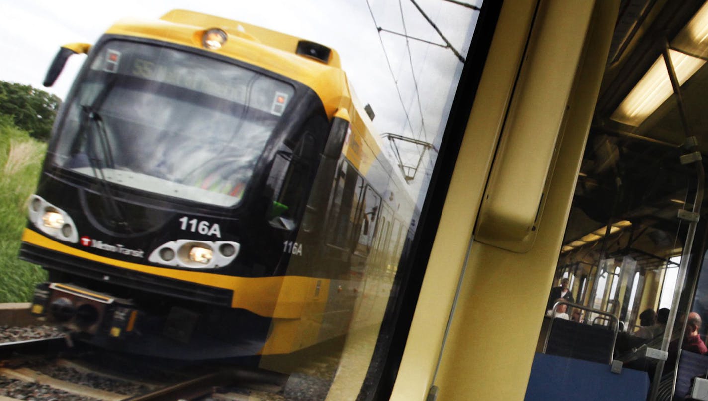 Riders take the light-rail during morning rush hour.