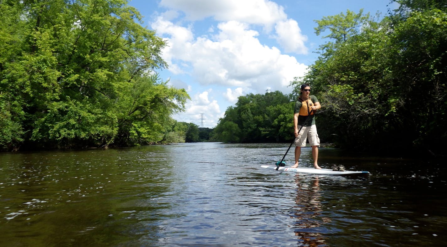 Photo by Lisa Meyers McClintick. Zac Meers paddles the Mississippi River near the Beaver Islands south of St. Cloud.