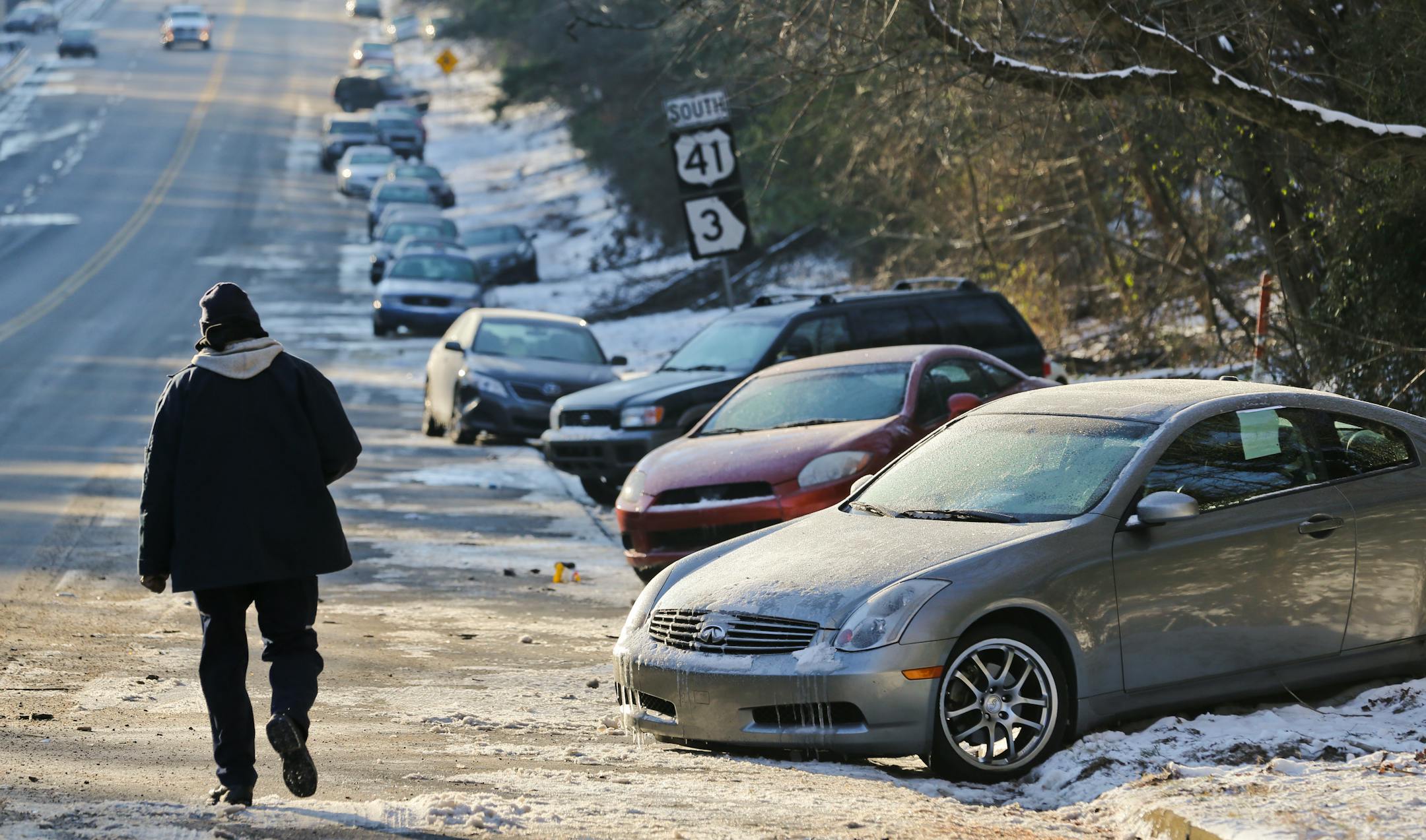 Jan. 30, 2014: Cars abandoned during an earlier snowstorm sit idle along Northside Parkway in Atlanta.