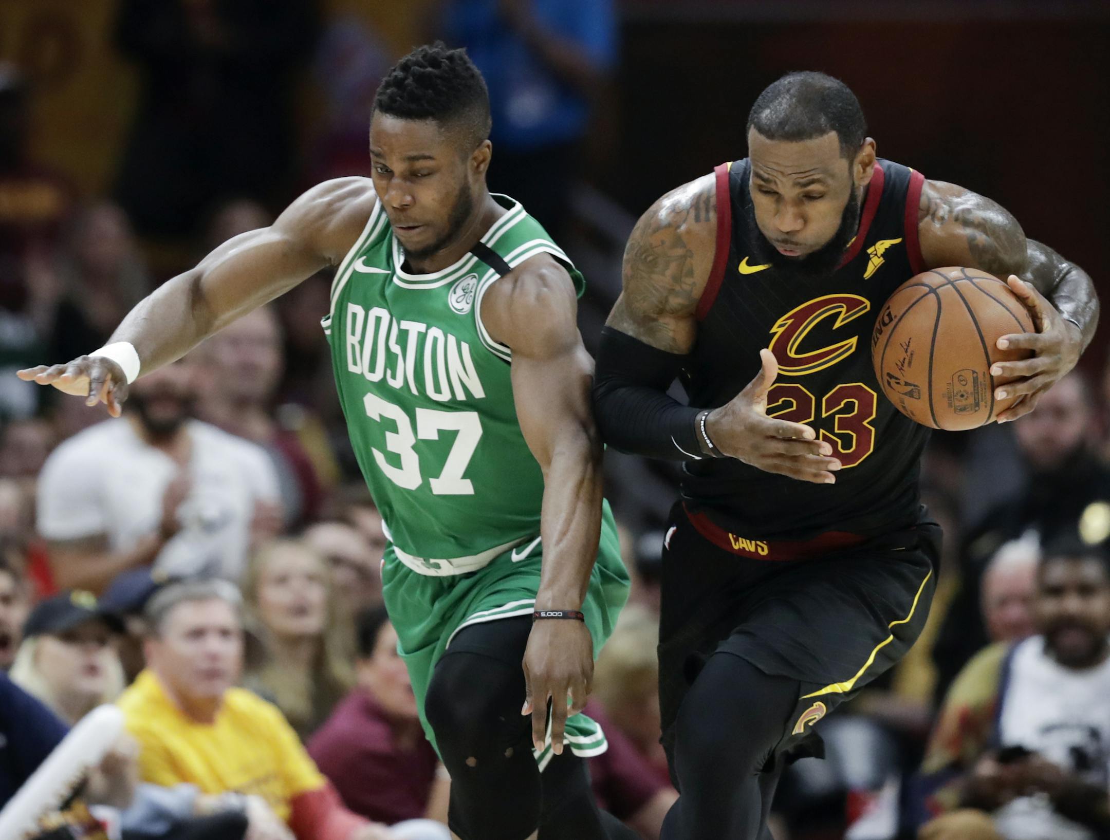 Cleveland Cavaliers' LeBron James (23) steals the ball from Boston Celtics' Semi Ojeleye (37) in the first half of Game 4 of the NBA basketball Eastern Conference finals Monday, May 21, 2018, in Cleveland. (AP Photo/Tony Dejak)
