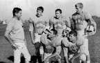 October 18, 1968: Coach Jim Gotta, looked over five of his Moorhead football players. They included (standing, from left) Paul Hanson, Dennis Kovash a