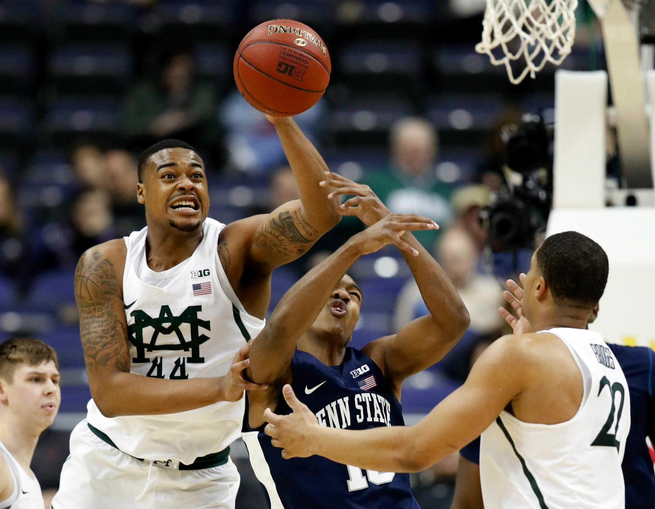 Michigan State forward Nick Ward (44) taps the ball away from Penn State guard Tony Carr (10) during the second half of an NCAA college basketball game in the Big Ten tournament, Thursday, March 9, 2017, in Washington. Michigan State won 78-51. (AP Photo/Alex Brandon)