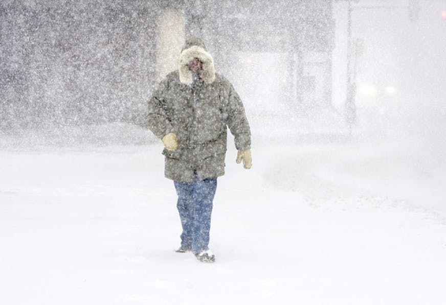 Dick Skogg of Duluth, Minn. walks down Superior Street toward the Lakewalk in Duluth on Sunday morning, Dec. 14, 2008. He walks five miles every day and didn't let the blizzard stop him from getting out the door. The Minnesota Transportation Department's Web site said blowing snow produced difficult driving conditions for most areas west and north of the Twin Cities. Many roads in western Minnesota closed.