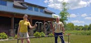 Art coordinator Lily Brutger, left, and owner Greg Konsor at Art in Motion, an art gallery, cafe and community space in Holdingford, Minn.