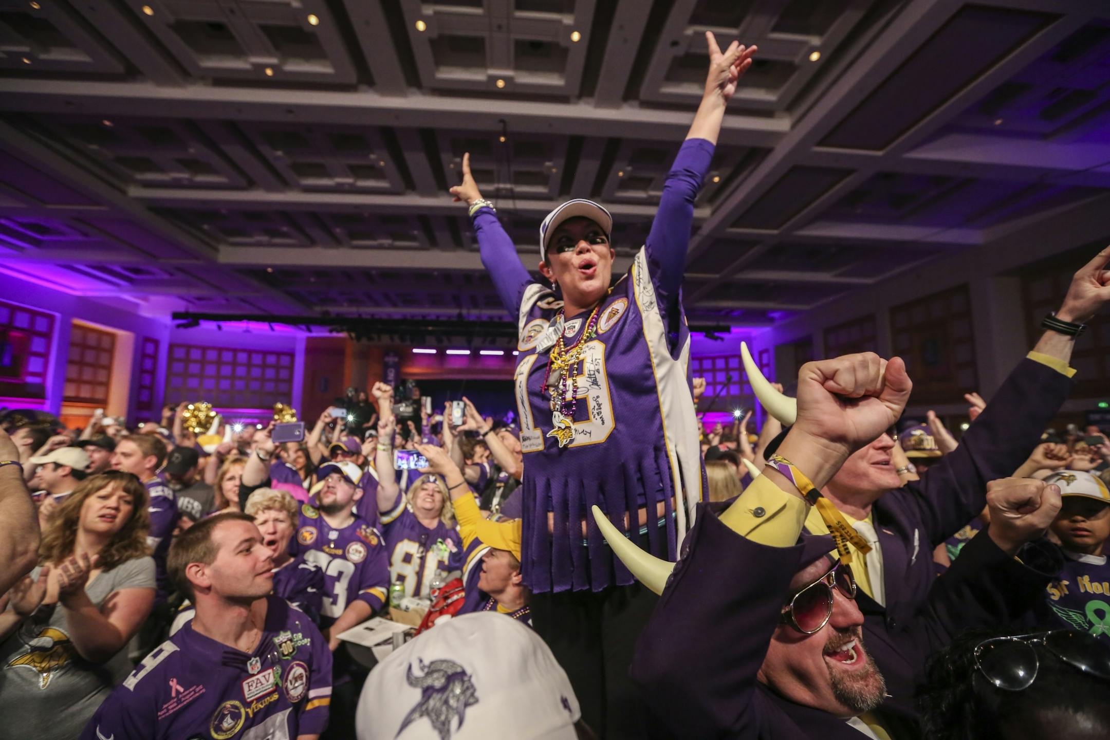Margi Patton, who came up from Florida to watch the draft with her Vikings friends, celebrated as the Vikings draft Trae Waynes on Thursday, April 30, 2015, at the Vikings Draft Party at the Convention Center in Minneapolis, Minn.