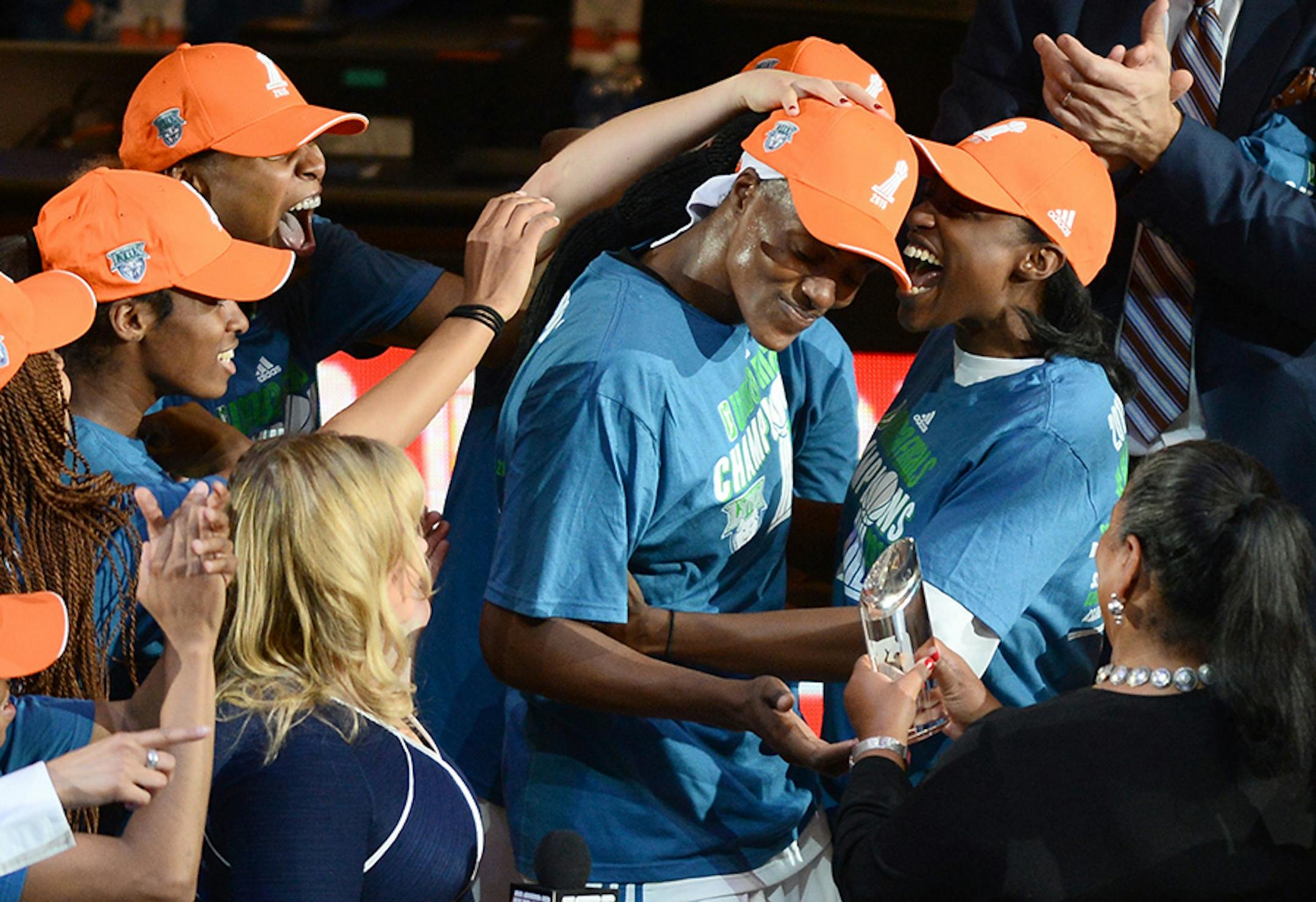 Minnesota Lynx center Sylvia Fowles (34), center, was congratulated by teammates including guard Kalana Greene (3), right, after being awarded with the MVP award Wednesday.