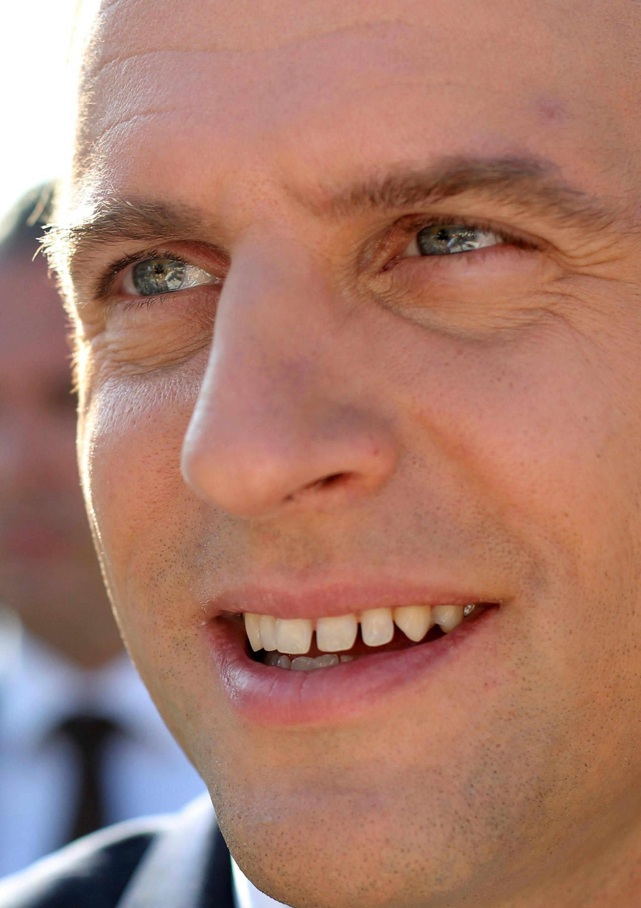 French President Emmanuel Macron meets people after voting in the final round of parliamentary elections, in the northern seaside town of Le Touquet, France, Sunday, June 18, 2017. French voters are choosing legislators for the National Assembly in the second round of parliamentary elections expected to hand a huge majority to President Emmanuel Macron's new centrist movement, allowing him to advance his pro-business, pro-European agenda. (AP Photo/Thibault Camus) ORG XMIT: REB128