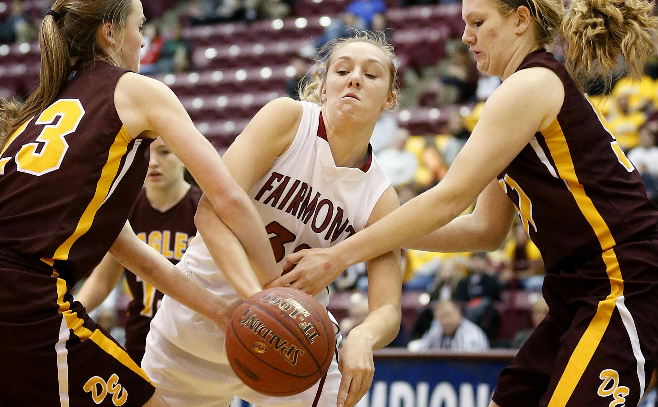 Madison Nelson (23) and Megan Hintz (51) of Dover-Eyota fought for the ball with Sierra Schrader (32) of Fairmont in the first half. ] CARLOS GONZALEZ cgonzalez@startribune.com, March 18, 2015, Minneapolis, Minn., 2015, Mariucci Arena, High School / Prep Girls Basketball, Class 2A quarterfinals, Fairmont vs. Dover-Eyota
