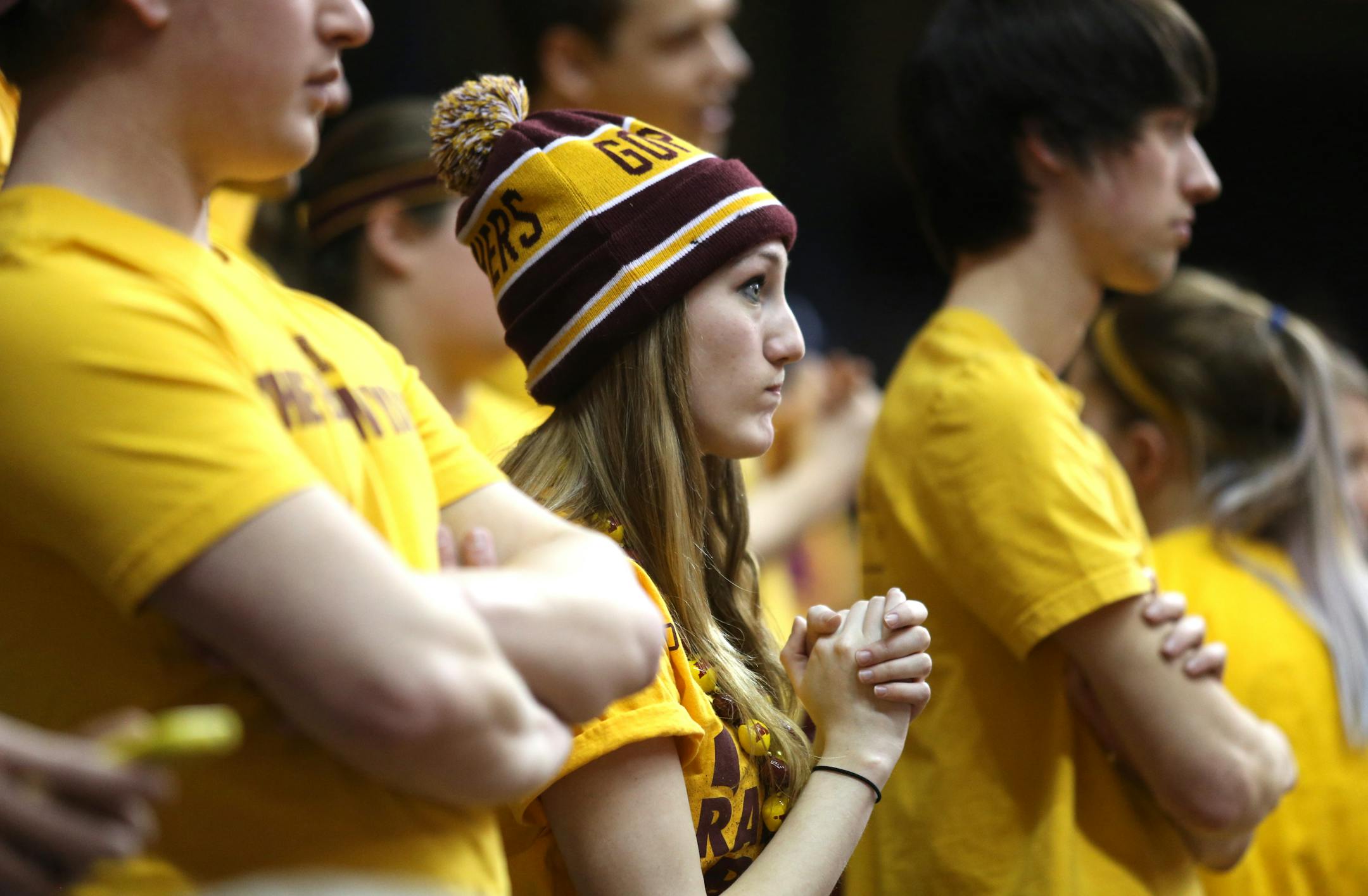Gopher fan Annamarie Rutledge watched the action on the court in the first half against High Point. ] (KYNDELL HARKNESS/STAR TRIBUNE) kyndell.harkness@startribune.com First round of the National Invitational Tournament at Williams Arena in Minneapolis Min, Tuesday March 18, 2014.