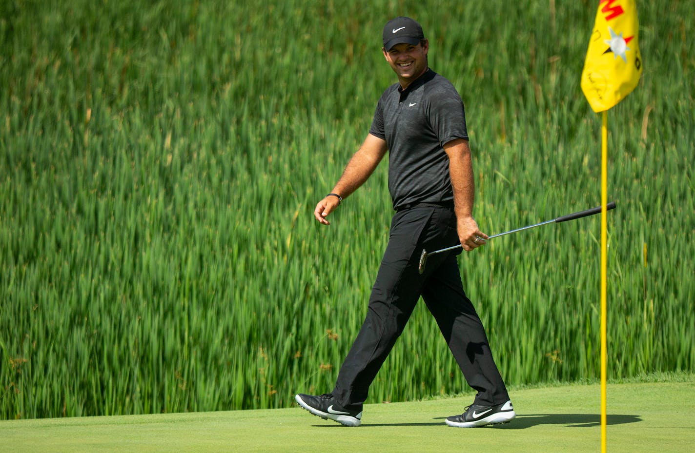 Patrick Reed smiled as he scoped out the putting green on the 10 hole Tuesday.