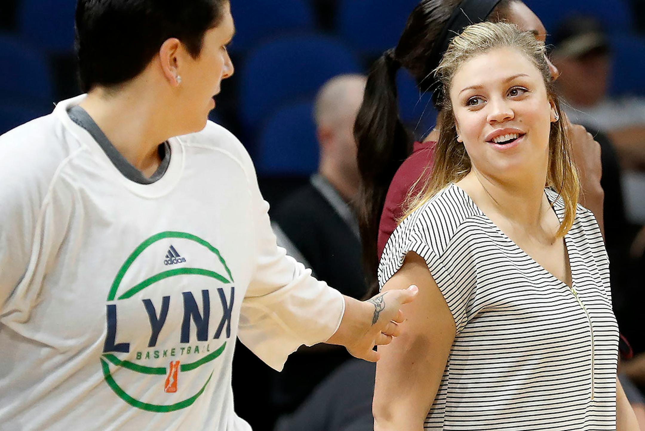 Rachel Banham of the Connecticut Sun was greeted by Janel McCarville before Sunday's game. Banham is a former Minnesota Gopher.