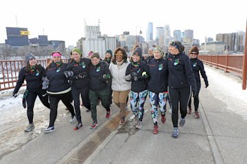 Oprah Winfrey walked Friday on the Stone Arch Bridge in Minneapolis with women from Minnesota's Kwe Pack.