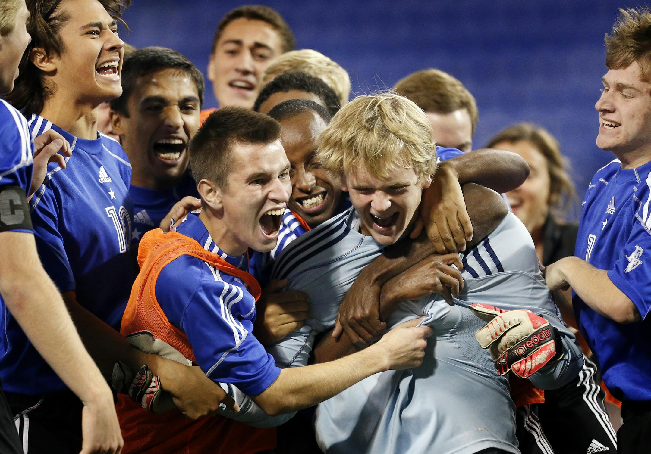 Eastview players celebrated around goalie Kyle Lamott (1) after beating Edina in an overtime shootout. ] CARLOS GONZALEZ cgonzalez@startribune.com October 28, 2013, Minneapolis, Minn., Mall of America Field - The Metrodome, Class 2A High School / prep boys soccer semifinals.Edina vs. Eastview
