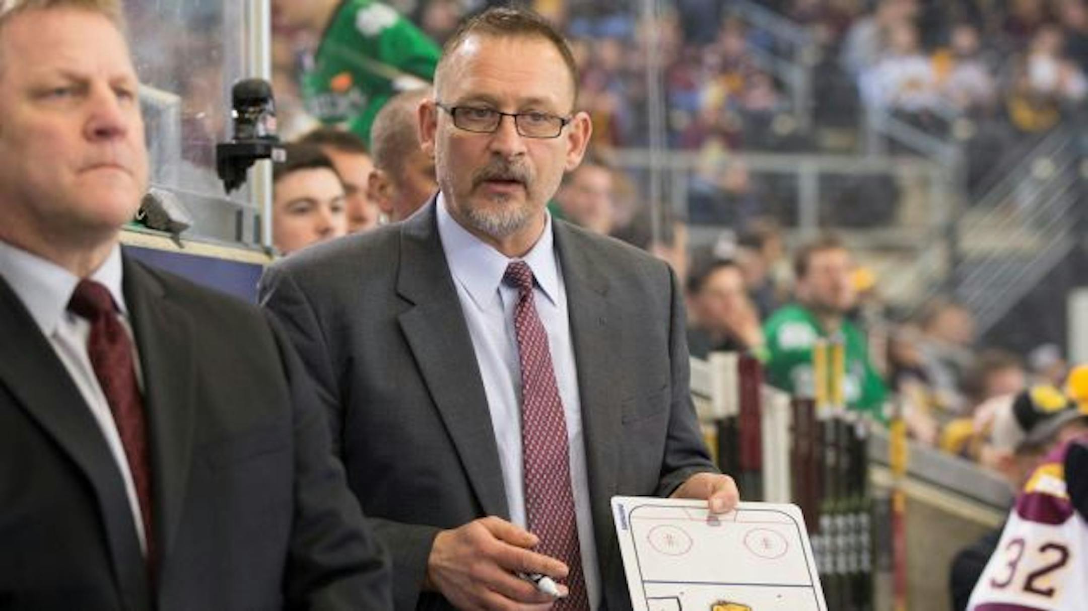 Minnesota Duluth associate head coach Jason Herter, right, with head coach Scott Sandelin