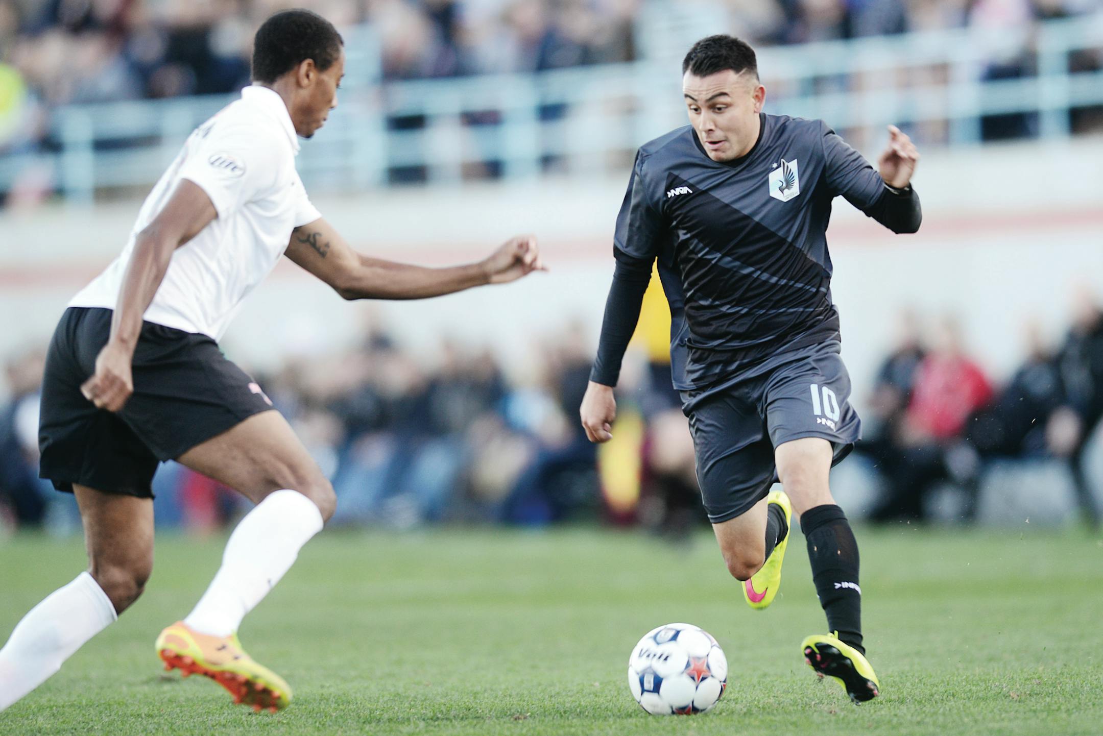 Miguel Ibarra (right) vs. San Antonio in April.