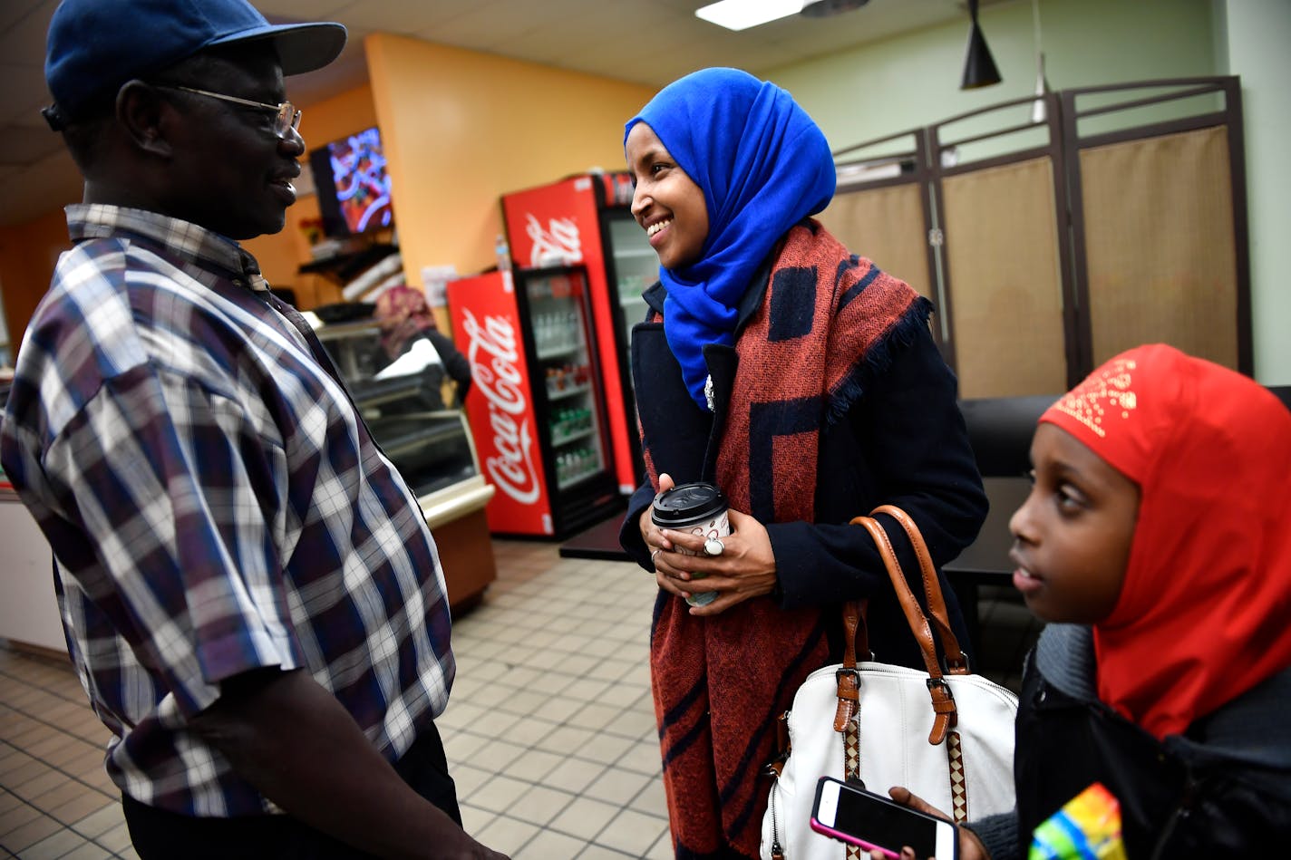 Ilhan Omar, state representative candidate for District 60B, spoke to a supporter, John Kamsin, after she gave an interview to the Star Tribune and ate dinner at Bir'raa restaurant in the Seward neighborhood Tuesday night. ] (AARON LAVINSKY/STAR TRIBUNE) aaron.lavinsky@startribune.com Minneapolis community activist Ilhan Omar won a historic election, becoming the nations first Somali-American elected to a statehouse. Her election night watch party was held Tuesday, Nov. 8, 2016 at the Courtyard