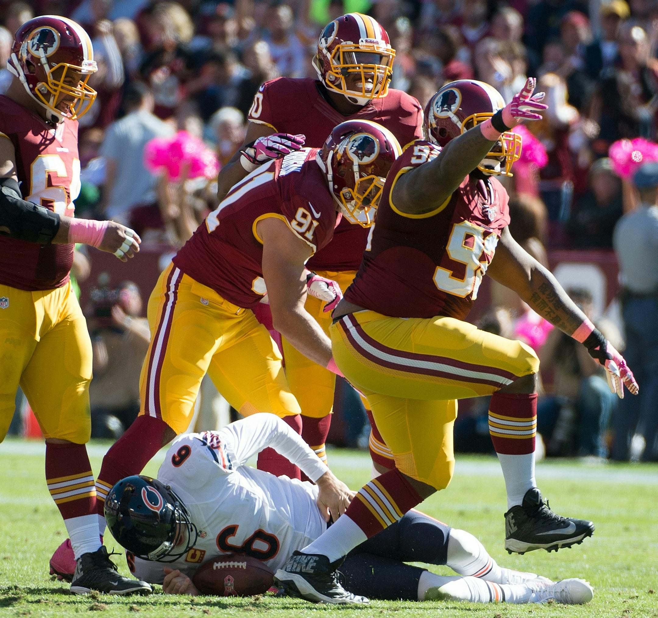 Washington Redskins defensive end Jarvis Jenkins (99) celebrated after sacking Chicago Bears quarterback Jay Cutler (6) during the first half at FedEx Field in Landover, MD, Sunday, October 20, 2013. Cutler (6) was injured on the play. (Harry E. Walker/MCT)