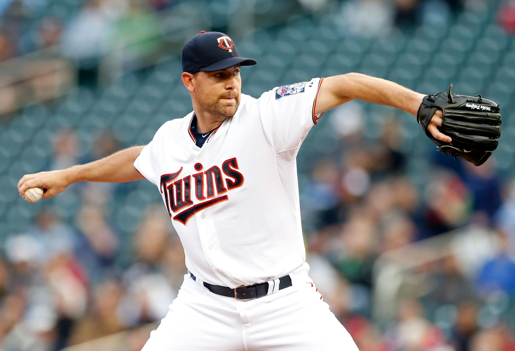 Minnesota Twins pitcher Mike Pelfrey throws against the Detroit Tigers in the first inning of a baseball game, Tuesday, April 28, 2015, in Minneapolis. (AP Photo/Jim Mone)