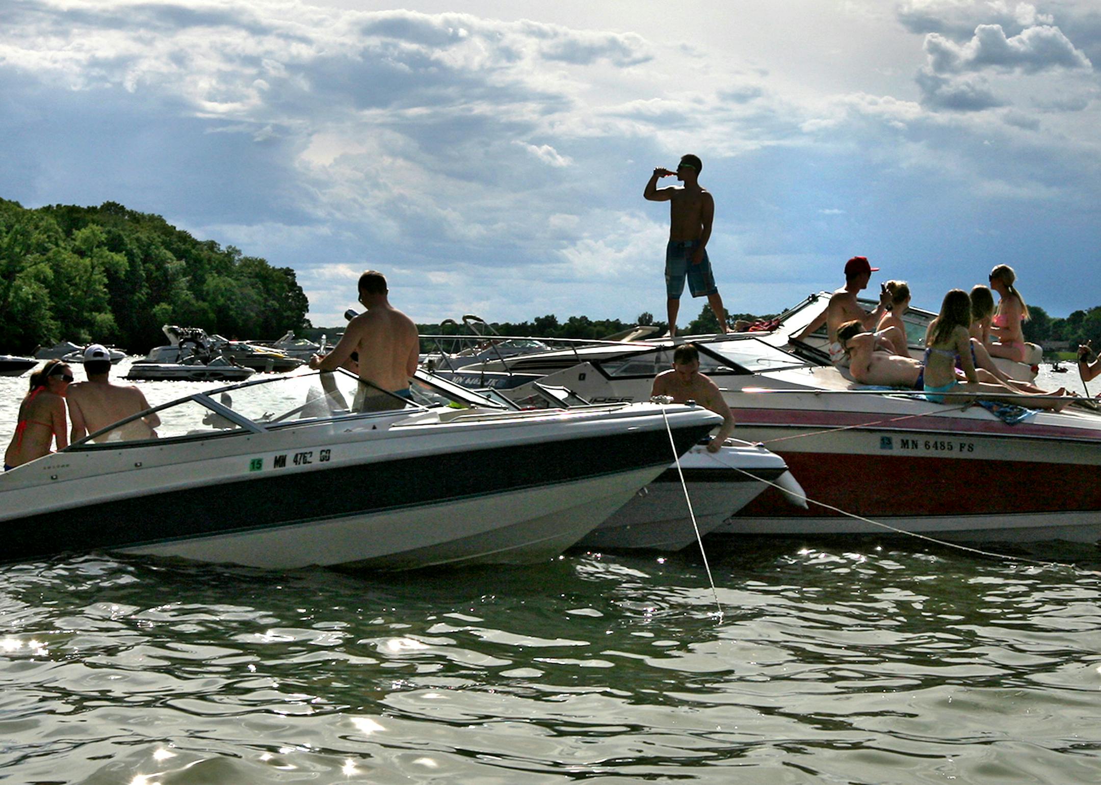 Boats connect to form small, temporary communities for the day at Big Island in Lake Minnetonka June 16, 2013. (Courtney Perry/Special to the Star Tribune) ORG XMIT: MIN1306171312137765