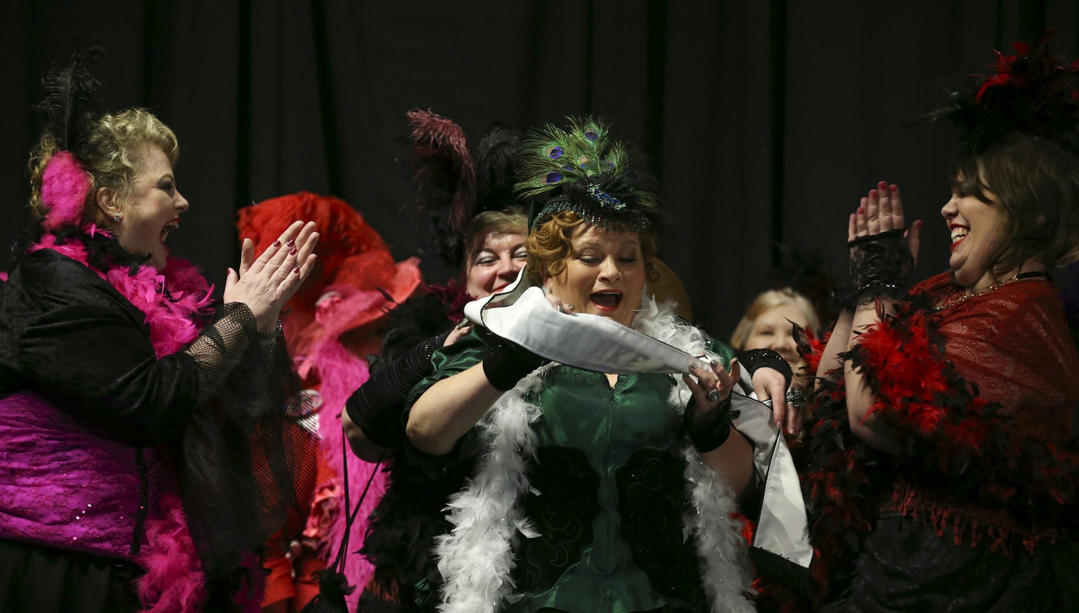 The Klondike Kate 2016 sash was placed on Theresa McConnon of St. Paul Wednesday night. She was flanked by the other semi-finalists, Kristen Coulthard of West St. Paul. left, and Amy Hopkins of Baldwin, WI. ] JEFF WHEELER • jeff.wheeler@startribune.com Third time was the charm for Theresa McConnon who was named Klondike Kate 2016 in the unofficial first event of the 2016 St. Paul Winter Carnival Wednesday night, January 13, 2016 at the Prom Center in Oakdale.