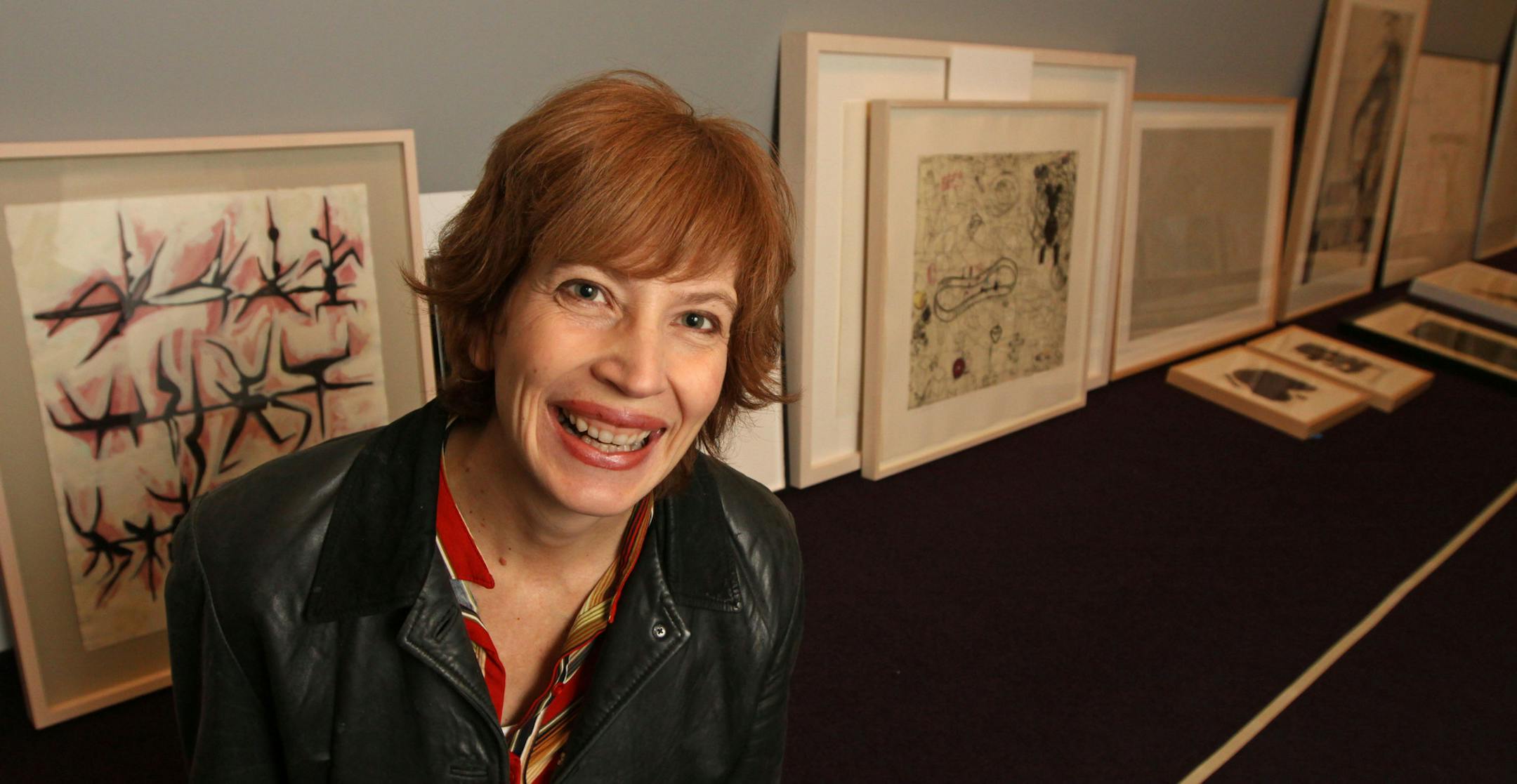 BRUCE BISPING ‚Ä¢ bbisping@startribune.com Minneapolis, MN., Friday, 12/10/10] (left to right) Darsie Alexander, Walker Art Center Curator for the "50/50" show arranged works on the floor before hanging. The show features works that were half picked by public votes and half by Alexander.