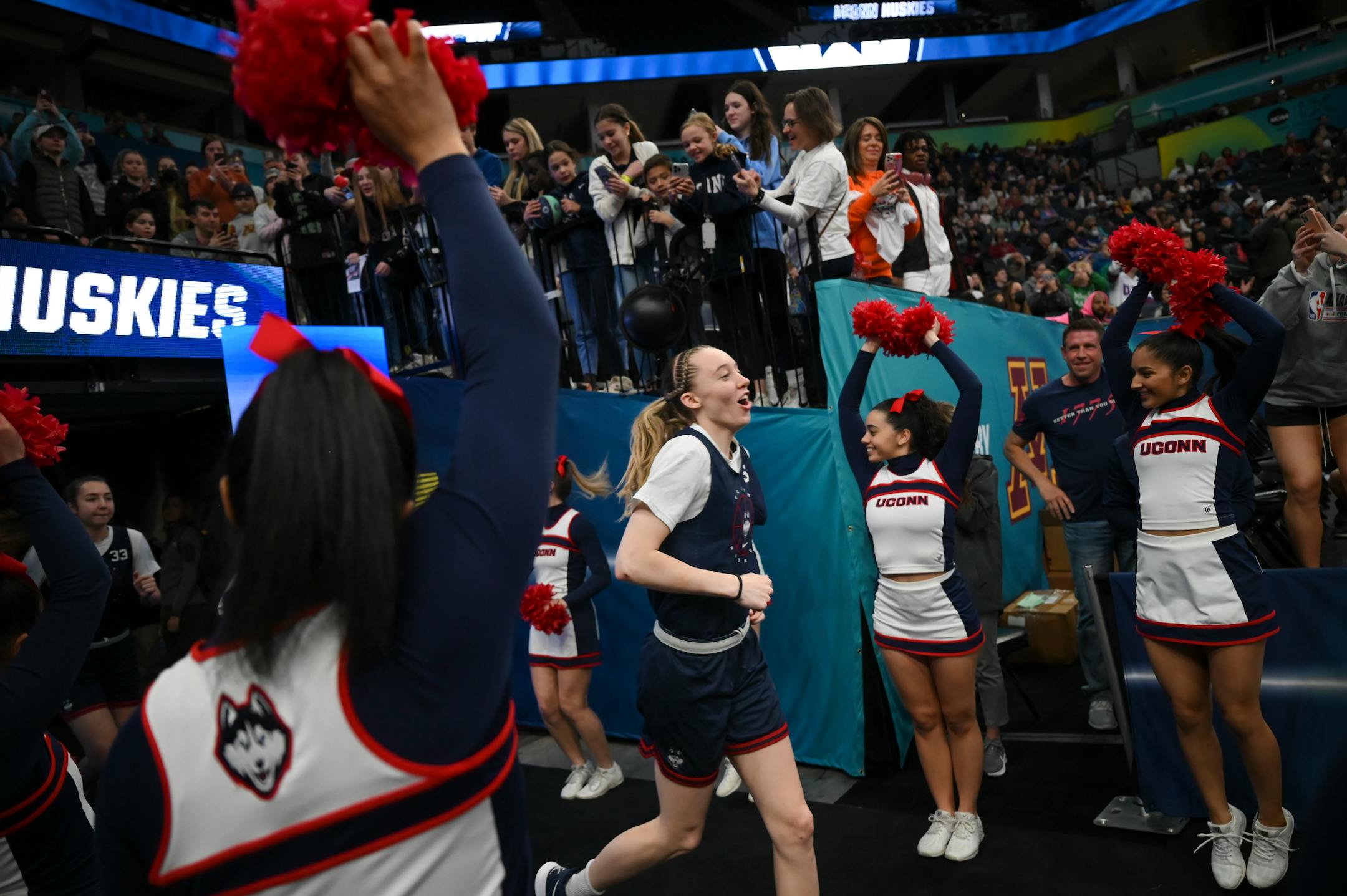 UConn players, including guard Paige Bueckers (5), arrive for a Final Four open practice held Saturday, April 2, 2022 at Target Center in Minneapolis, Minn.