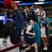 UConn players, including guard Paige Bueckers (5), arrive for a Final Four open practice held Saturday, April 2, 2022 at Target Center in Minneapolis,