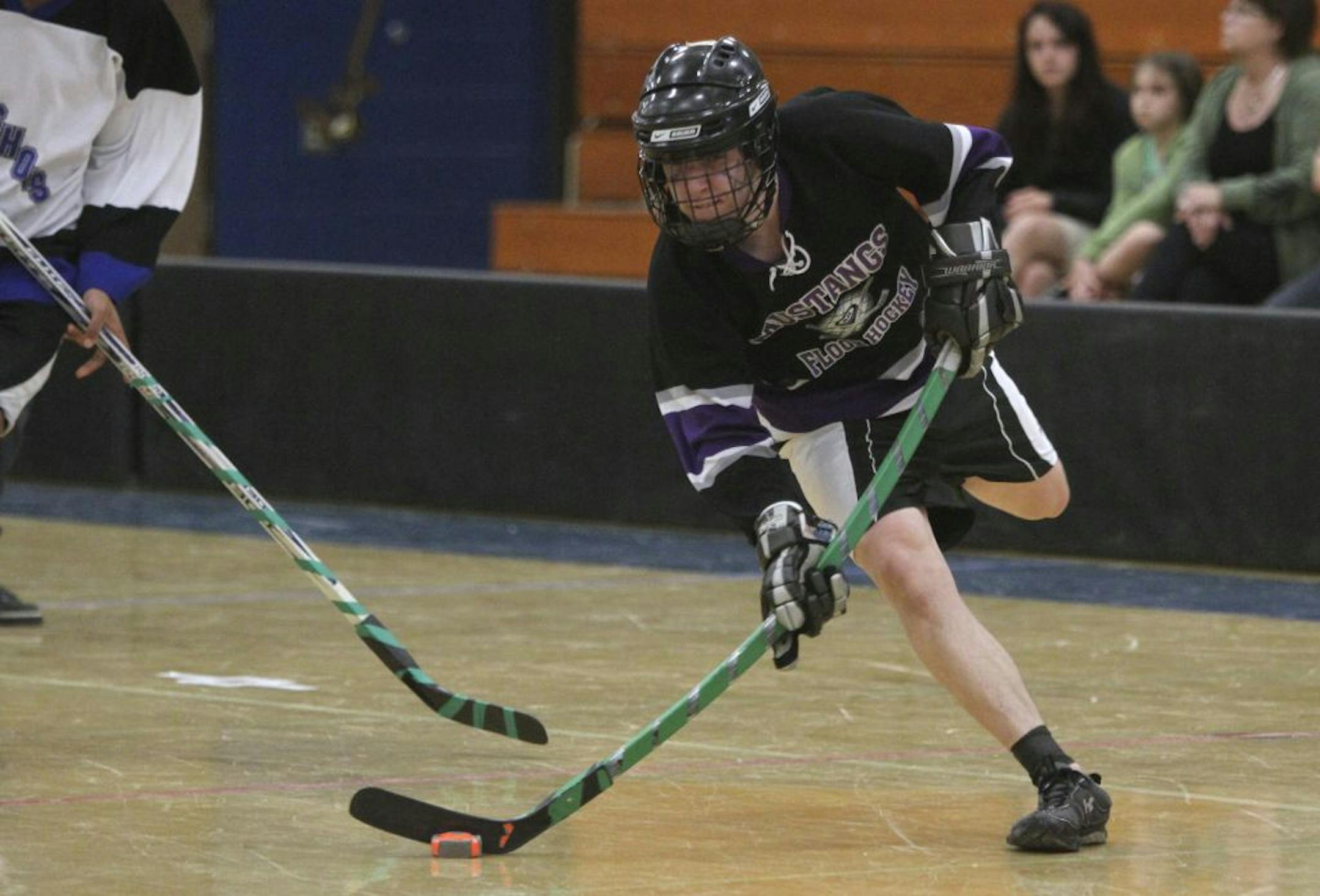 Anoka-Hennepin Tyler Kurkowski took a shot on goal and scored during the first period of the state championship adapted for cognitively impaired floor hockey at Bloomington Jefferson High School in Bloomington Min., Saturday, March 17, 2012.