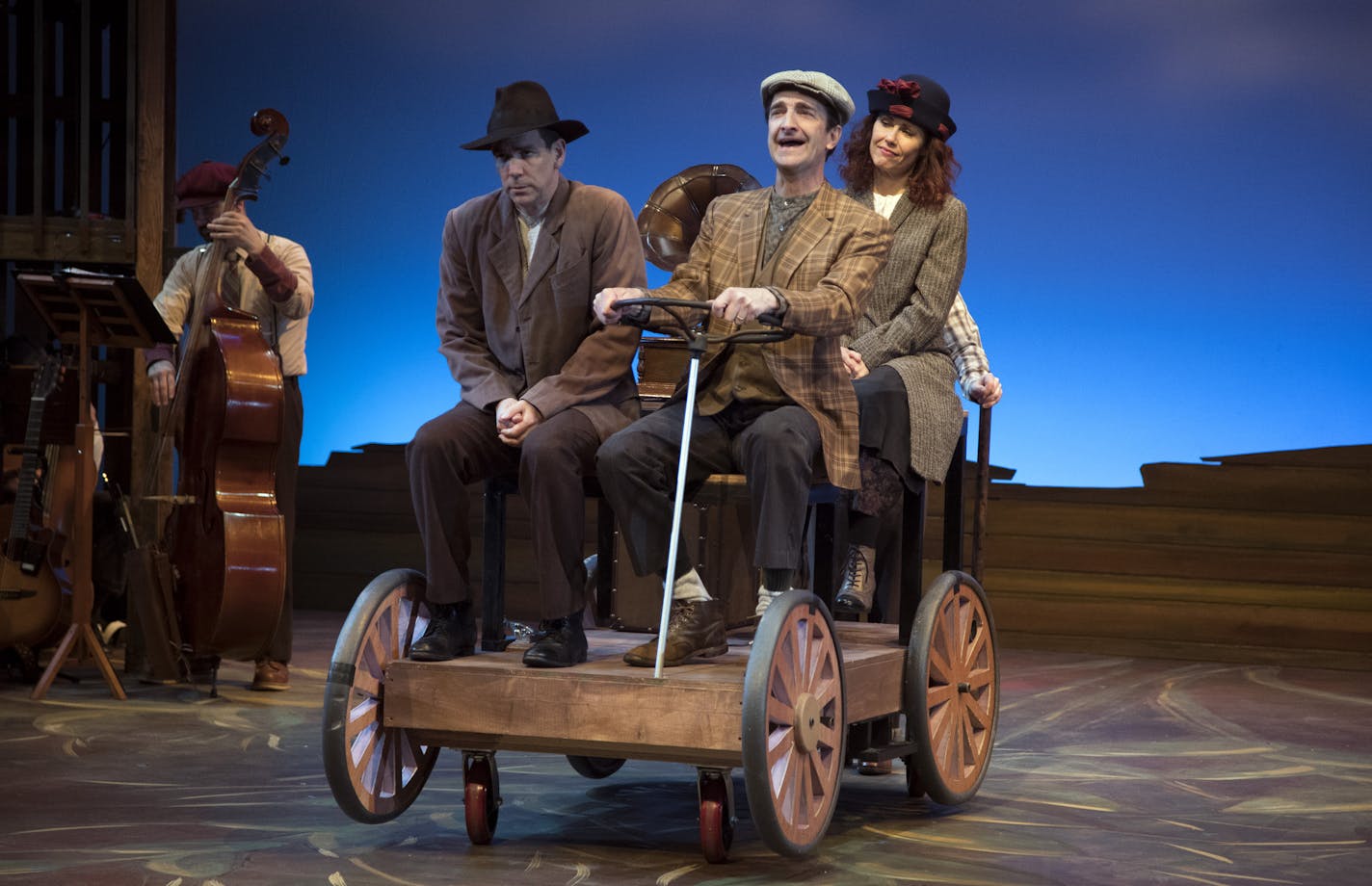 Jon Andrew Hegge takes Robert O. Berdahl and Ann Michels to their destination in "Sweet Land, the Musical" at the History Theatre.