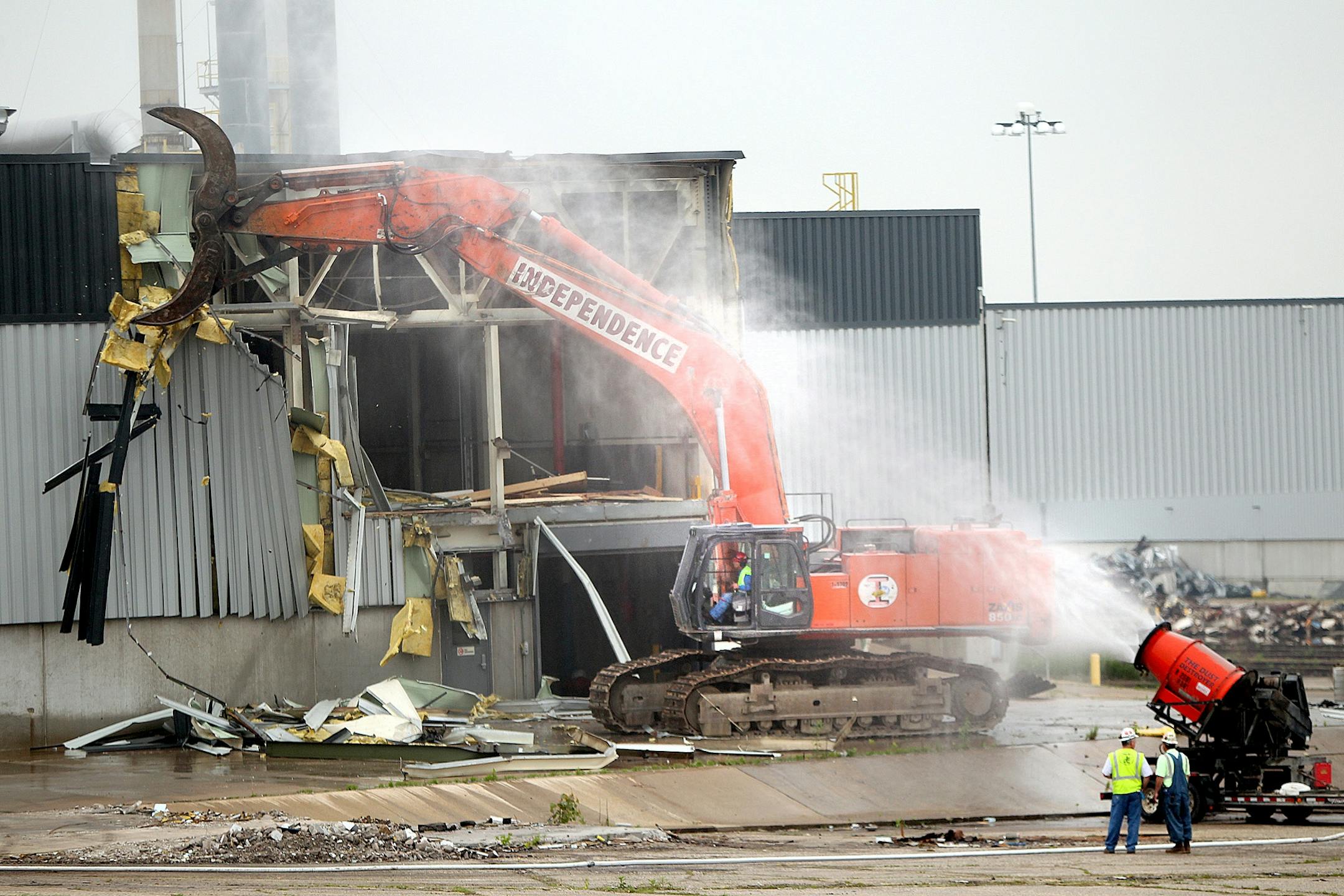 Workers demolish the paint building at the former Twin Cities Ford Assembly Plant on June 10, 2013 in St. Paul.
