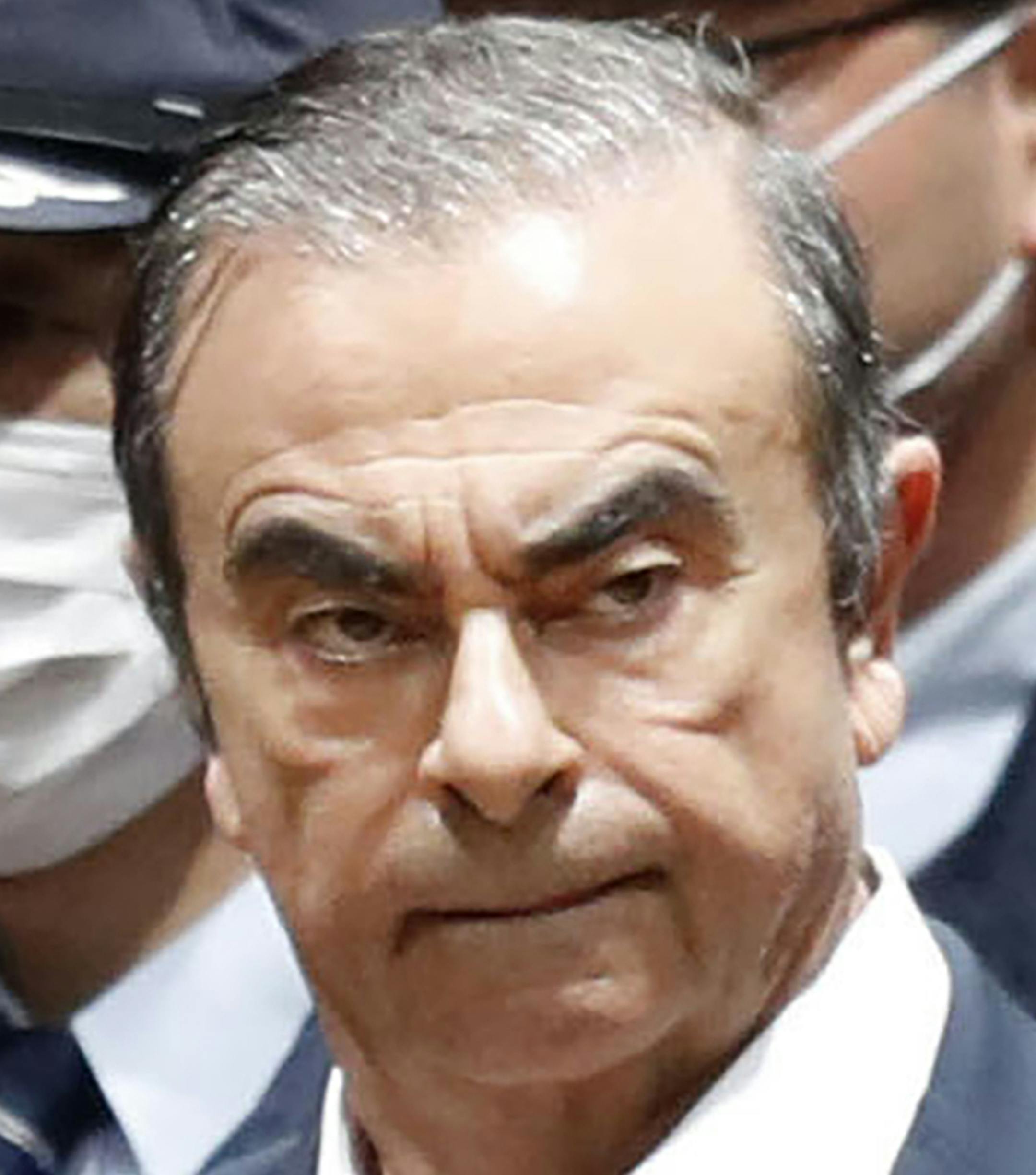 FILE - In this April 25, 2019, file photo, former Nissan Chairman Carlos Ghosn leaves Tokyo Detention Center in Tokyo. Ghosn plans a news conference later Friday, June 28, that would be his first since he was arrested in November on financial misconduct allegations.(Kyodo News via AP, File)