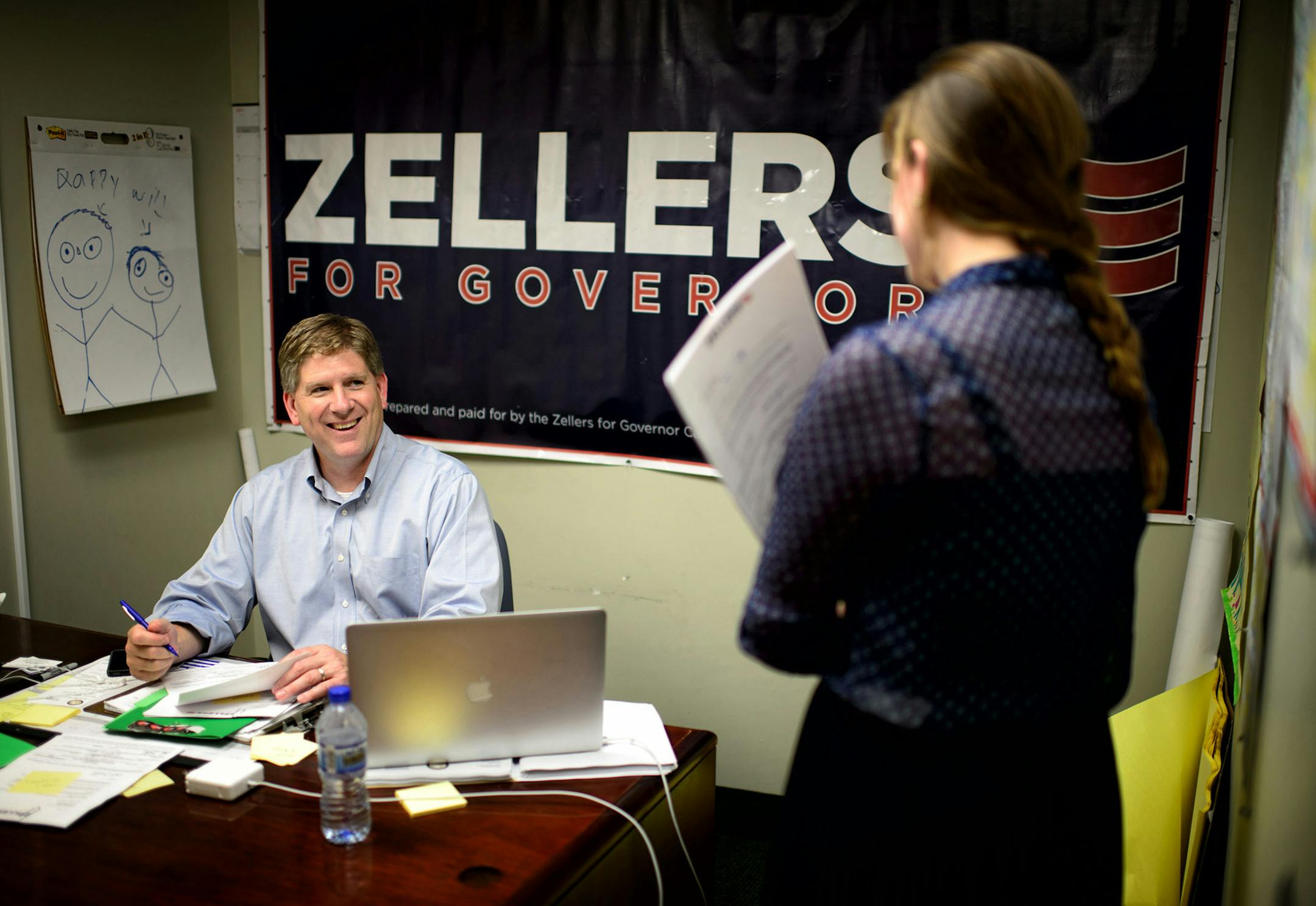 Kurt Zellers made campaign calls to primary election voters from his campaign office in Osseo. Press secretary Caitlyn Stenerson brought some thank you letters to sign. July 8, 2014 ] GLEN STUBBE * gstubbe@startribune.com ORG XMIT: MIN1407091330500363