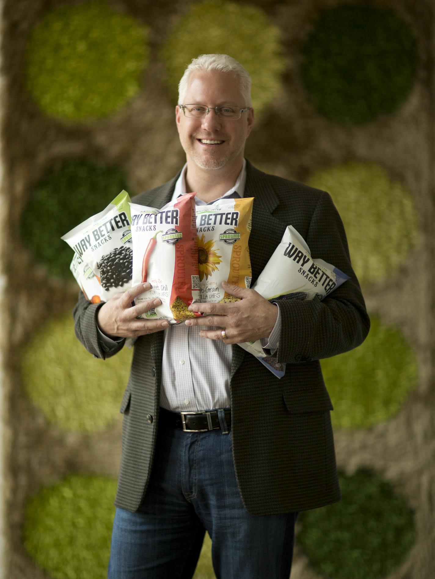 Jim Breen, who once worked here for Creamette, has relocated his Way Better Snacks company, Simply Sprouted, from Long Island to the TractorWorks building in Minneapolis' North Loop. Jim Breen with a sampling of his company's Way Better chips, photographed in their new offices in the TractorWorks building in Minneapolis Thursday afternoon, June 20, 2013. ] JEFF WHEELER &#x201a;&#xc4;&#xa2; jeff.wheeler@startribune.com