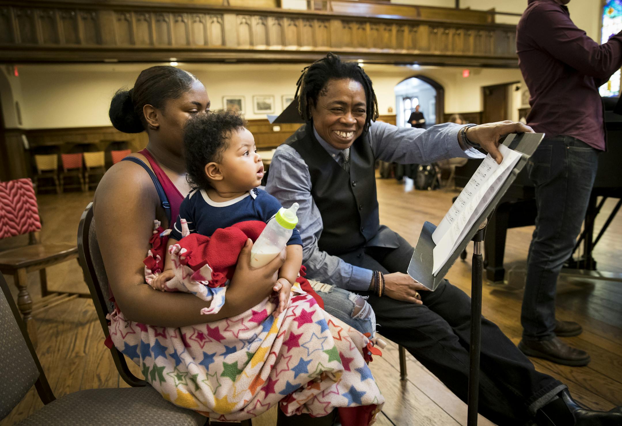 Guest artist Melanie DeMore pointed to the music as Amina Caver sat on her mother Arianna Caver's lap listening to a song for the first time Arianna had wrote for her as park of the Lullaby project at Plymouth Congressional Church on Tuesday, January 10, 2016, in Minneapolis, Minn. ] RENEE JONES SCHNEIDER &#x2022; renee.jones@startribune.com