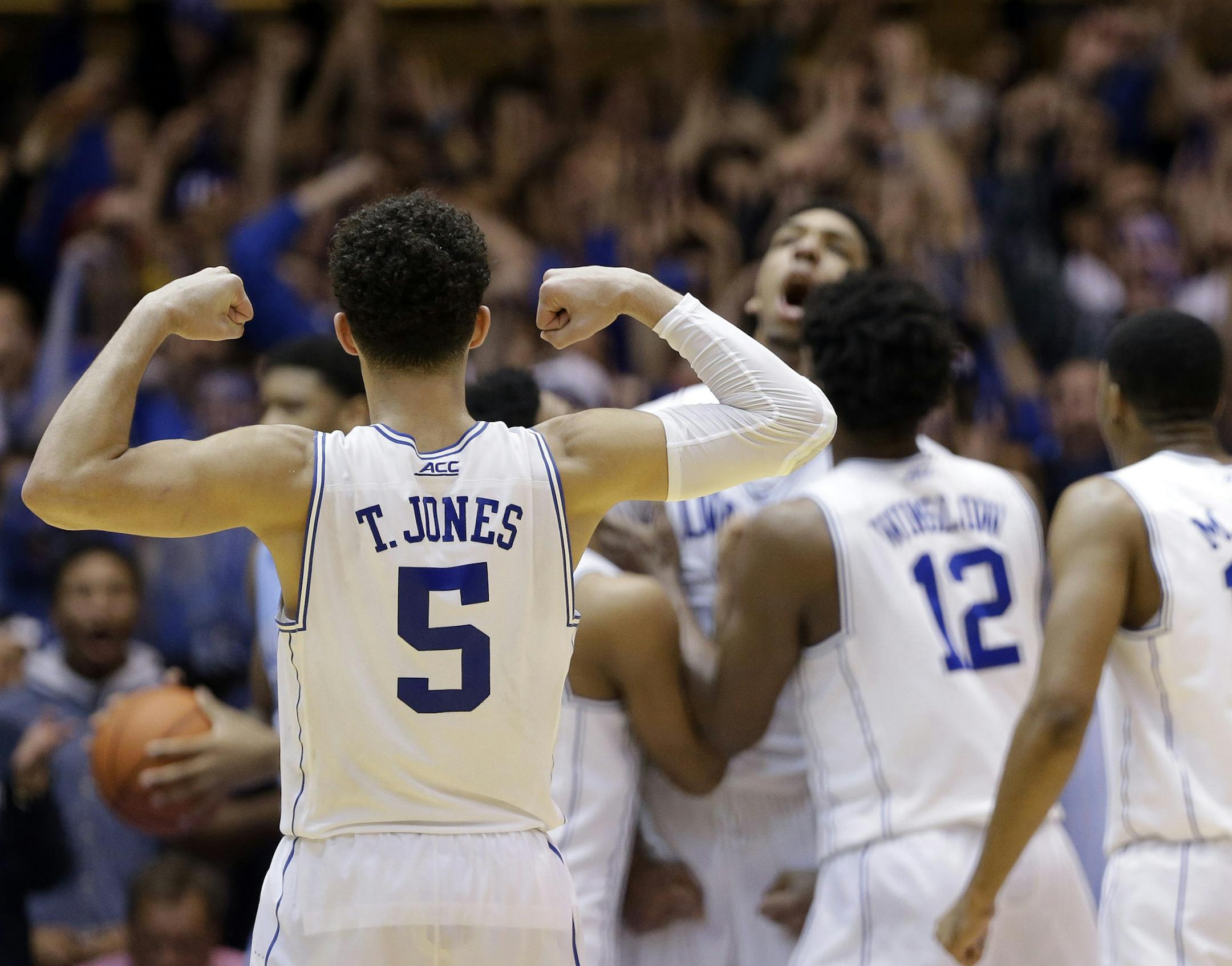 Duke's Tyus Jones (5) reacts following a play against North Carolina during the second half of an NCAA college basketball game in Durham, N.C., Wednesday, Feb. 18, 2015. Duke won 92-90 in overtime. (AP Photo/Gerry Broome)