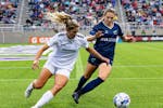 Bavarian United's Megan Cornell, left, and the Minnesota Aurora's Sophie French battle for the ball Thursday night at TCO Stadium.