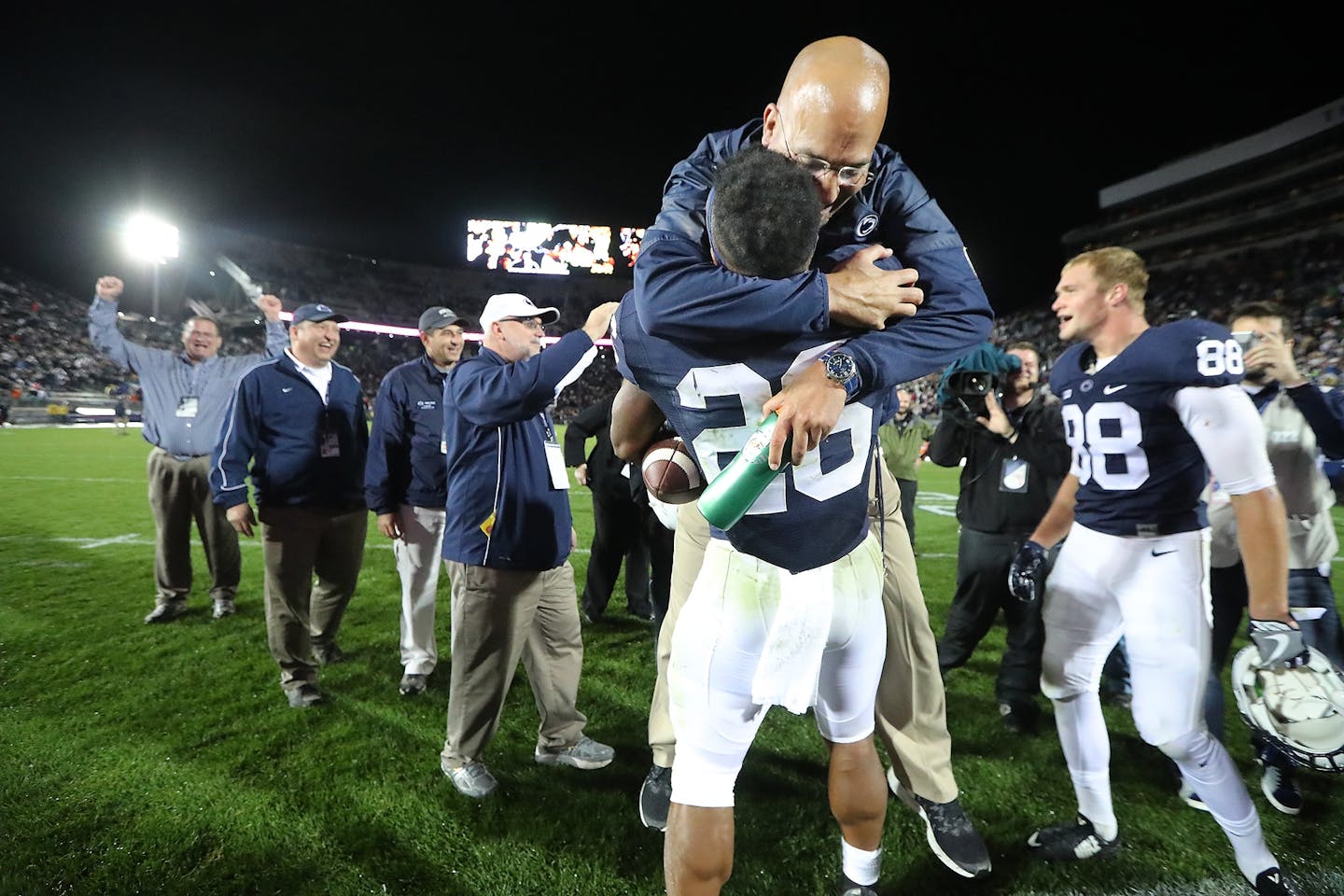 Penn State's head coach James Franklin gave running back Saquon Barkley a big hug after he scored the winning touchdown beating Minnesota 29-23 in overtime at Beaver Stadium, Saturday, October 1, 2016 in State College, PA.